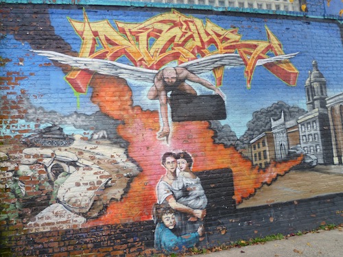 Mural on the front of TATS CRU's Offices in Hunts Point, Bronx