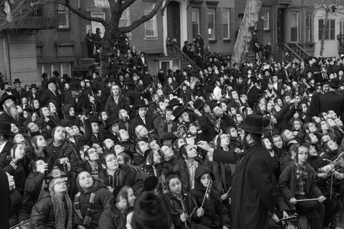 Satmar boys looking up at a helicopter, while in the street for celebrations related to a prominent Rabbi visiting from Israel. Photo Credit: Mark Hanover