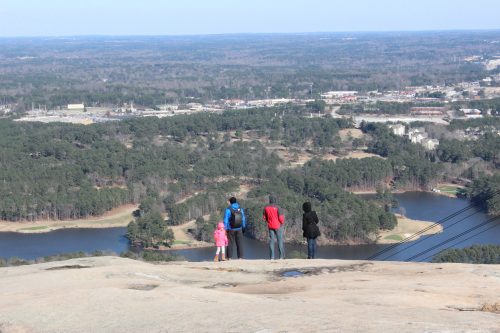 A family taking in the view from the top of Stone Mountain.