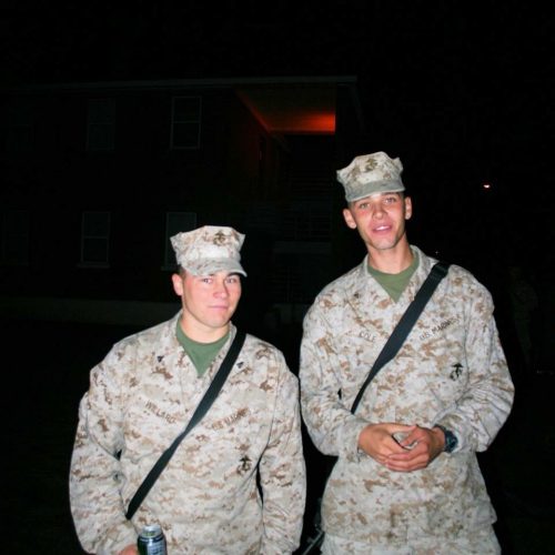 Dylan Cole (right) poses with his friend the night before they deployed to Afghanistan